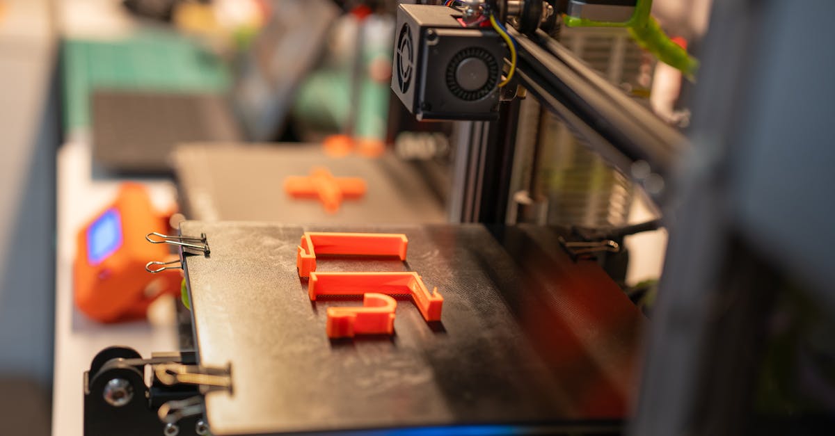 3D printed parts showing various marking methods including raised serial numbers, recessed date codes, and embedded QR codes